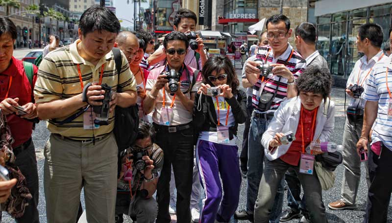 chinese tourists camera