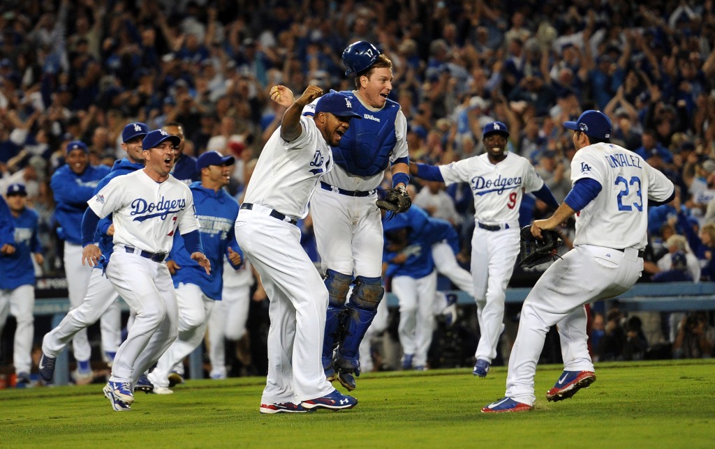 The Los Angeles Dodgers run on to the field after beating the Atlanta Braves during game 4 of the NLDS at Dodger Stadium Monday, October 7, 2013. The Dodgers beat the Braves 4-3.(Photo by Hans Gutkencht/Los Angeles Daily News)