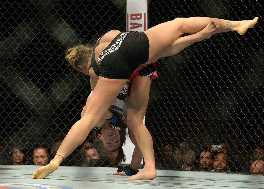 Champion Ronda Rousey beats Miesha Tate UFC 168.