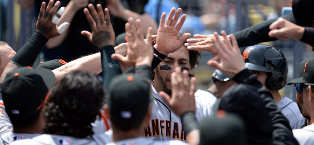 The Giants'  Michael Morse #38 enters the dugout after scoring in the 1st inning against the Dodegrs at Dodger Stadium Friday 4, 2014. The Giants beat the Dodgers 8-4.  (Photo by Hans Gutknecht/Los Angeles Daily News)