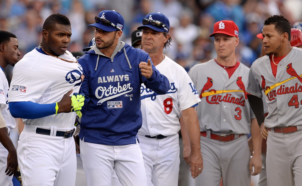 Dodgers Yasiel Puig #66 is held back by Andre Ethier and  manager Don Mattingly during a bench clearing alteration after he was hit by a Cardinals Adam Wainwright #50 pitch during Game 1 of  the National League Division Series, at Dodger Stadium Friday October 3, 2014. (Photo by Hans Gutknecht/Los Angeles Daily News)