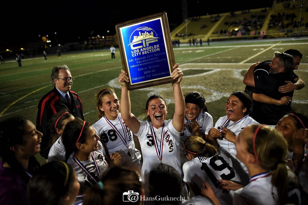 Verdugo Hills’ Kelsey Sanford #3 hold up the championship plaque after they beat Maywood to win the L.A. City Section Division 3 girls soccer final at Los Angeles Valley College, in Valley Glen, CA, Friday, March 6, 2015. (Photo by Hans Gutknecht/Los Angeles Daily News)
