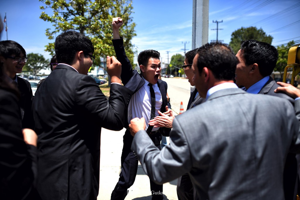 Team members have a good time during a ceremony  to unveil a sign commemorating Granada Hills Charter 4 National Academic Decathlon championships outside the school on Zelzah Ave. in Granada Hills, Thursday, May 28, 2015. Granada Hills Charter remains the only charter school in the almost 35-year history of the National Academic Decathlon competition to claim the national title and the only public school, traditional or charter, to capture the national title three years in a row and now four times in five years.  (Photo by Hans Gutknecht/Los Angeles Daily News)