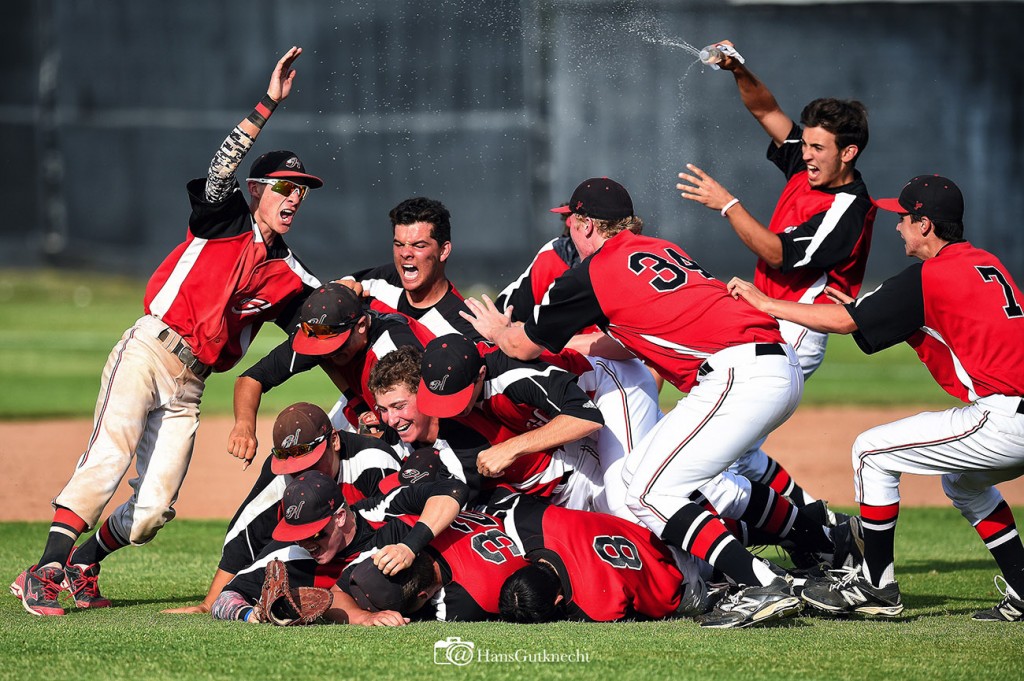 Hart pitcher Paul Richan #32 is mobbed by teammates after recording the final out during their  CIF Southern Section Division 1 quarterfinal baseball game against JSerra at Hart High School in Newhall, CA. Friday, May 29, 2015.  Hart beat JSerra 10-6 to advance. (Photo by Hans Gutknecht/Los Angeles Daily News)