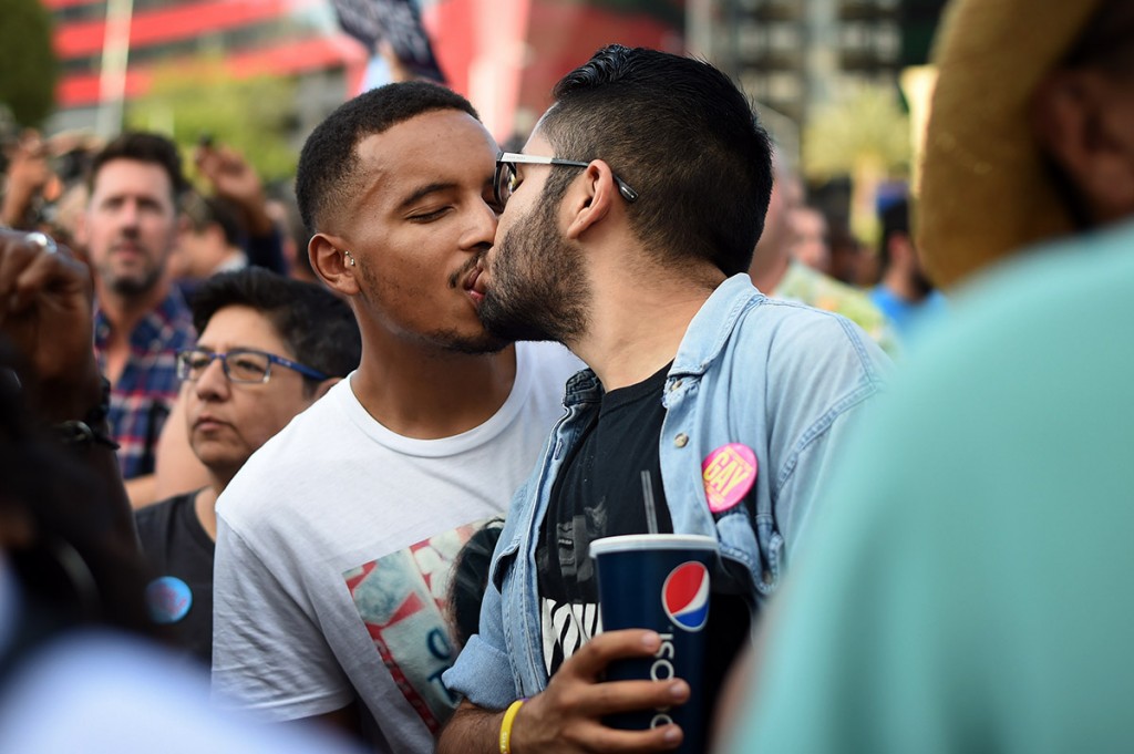 A couple share a kiss at West Hollywood Park in West Hollywood to celebrate the  Supreme Court ruling in favor of same-sex marriage nationwide. (Photo by Hans Gutknecht/Los Angeles Daily News)