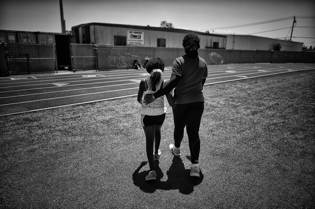 Democratic Republic of Congo Special Olympic athlete Sara Mulekia, 14-years-old, walks with coach Mwilambwe/Ngoy Marijo Bibiche during practice at Santa Maria High School in Santa Maria, CA, Thursday, July 23, 2016. This is the first time athletes from the DRC will compete in the Special Olympics World Games. That is largely due to civil war that engulfed the nation for seven years until a tenuous peace agreement was reached in 2013.