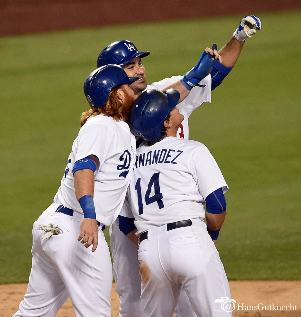 The Dodgers’ Adrian Gonzalez #23 celebrates with Justin Turner #10 and Enrique Hernandez #14 after he hit a 3-run homer in the 5th during their MLB game against the Reds at Dodger Stadium, Friday, August 14, 2015.  (Photo by Hans Gutknecht/Los Angeles Daily News)
