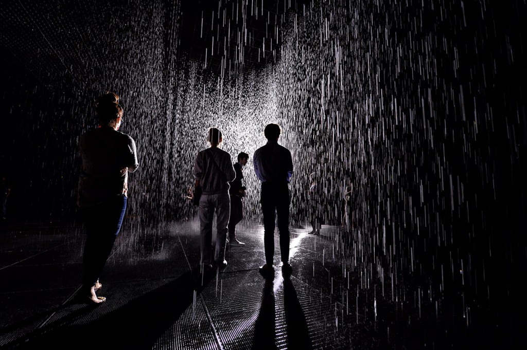 People make their way through the 'Rain Room' at the Los Angeles County Museum of Art (LACMA) in Los Angeles on October 28, 2013. The exhibit creates wall  of falling water that stops where people walk. The exhibit was created by Random International a art collaborative based in London. (Photo by Hans Gutknecht/Los Angeles Daily News)
