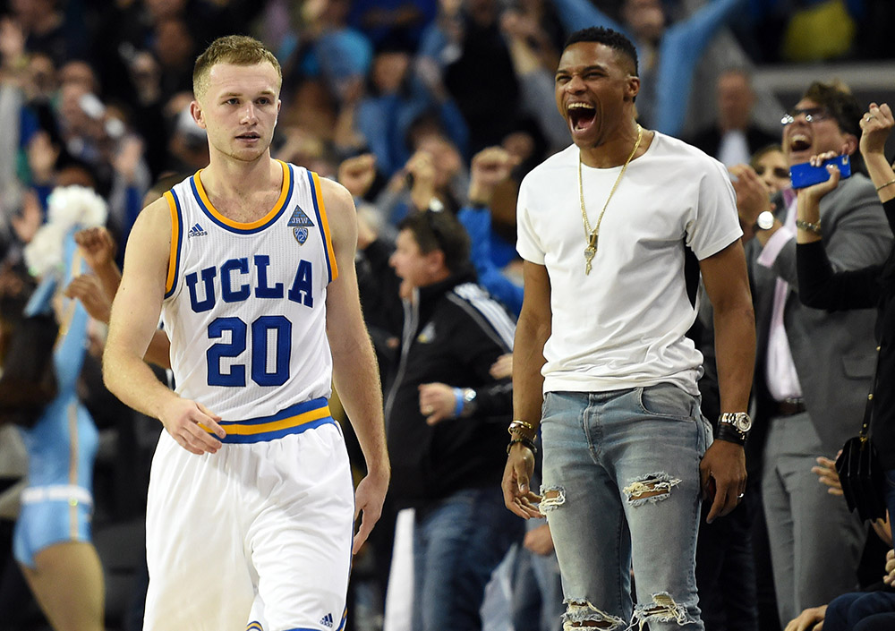 UCLA’s Bryce Alford #20 walks by a cheering Russell Westbrook after Alford hit the game winning shot with 4 seconds remaining during their basketball game against Arizona at Pauley Pavilion on the UCLA campus in Los Angeles, CA, Thursday, January 7, 2016. UCLA beat Arizona 87-84. (Photo by Hans Gutknecht/Los Angeles Daily News)