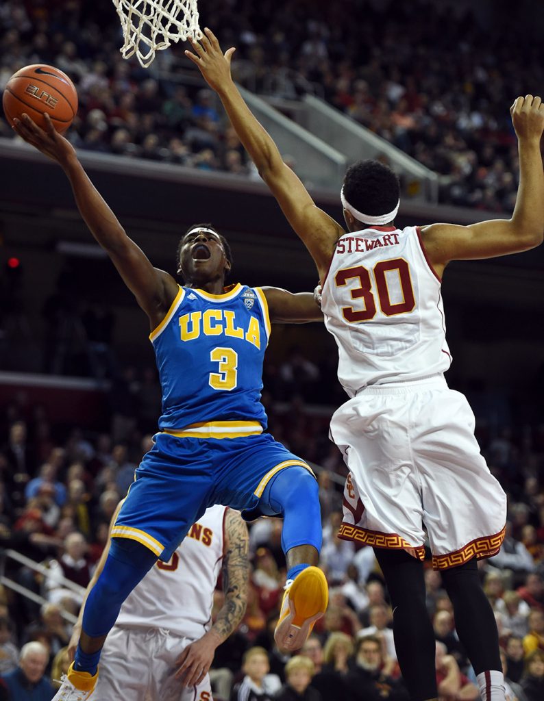 UCLA’s Aaron Holiday #3 lays the ball up as USC’s Elijah Stewart #30 defend sat the Galen Center in Los Angeles, February 4, 2016. (Hans Gutknecht/Los Angeles Daily News)