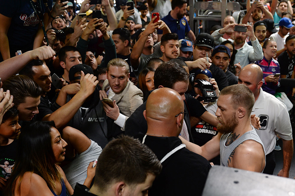 UFC featherweight champion Conor McGregor signs some autographs after  a press conference at the UFC Gym in Torrance, Wednesday, February 24, 2016. McGregor and Nate Diaz will face each other at UFC 196 in Las Vegas on March 5, 2016. (Photo by Hans Gutknecht/Los Angeles Daily News)