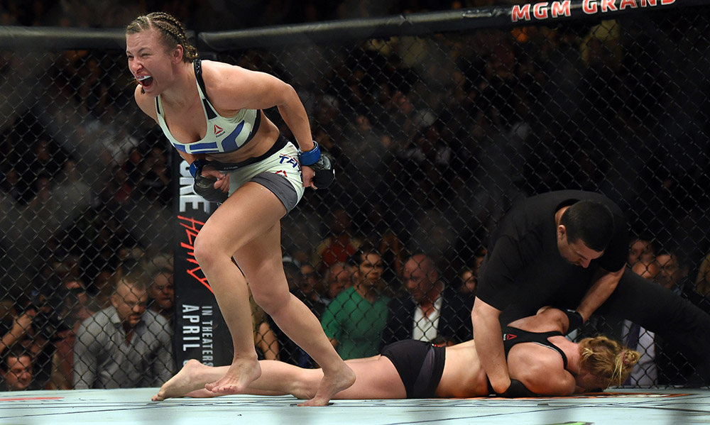 The new women's bantamweight champion Miesha Tate  reacts after defeating Holly Holm with a choke during UFC 196 at the MGM Grand Garden Arena in Las Vegas, Saturday, March 5, 2016. (Photo by Hans Gutknecht/Los Angeles Daily News)