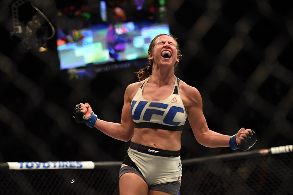 Miesha Tate defeats Holly Holm to with the women's bantamweight champion during UFC 196 at the MGM Grand Garden Arena in Las Vegas, Saturday, March 5, 2016. <span id=