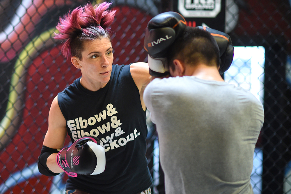 Colleen Schneider trains with Dustin Shaw at HQ Brand Training Center in Los Angeles, Friday, April 22, 2016. Schneider will be fighting for the Invicta Fighting Championships bantamweight title against champion Tonya Evinger at Invicta FC 17 in Costa Mesa, May 7. (Photo by Hans Gutknecht/Los Angeles Daily News)