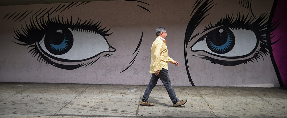 A man walks along S. Ardmore Ave in Los Angeles, Tuesday, May 3, 2016. (Photo by Hans Gutknecht/Los Angeles Daily News)