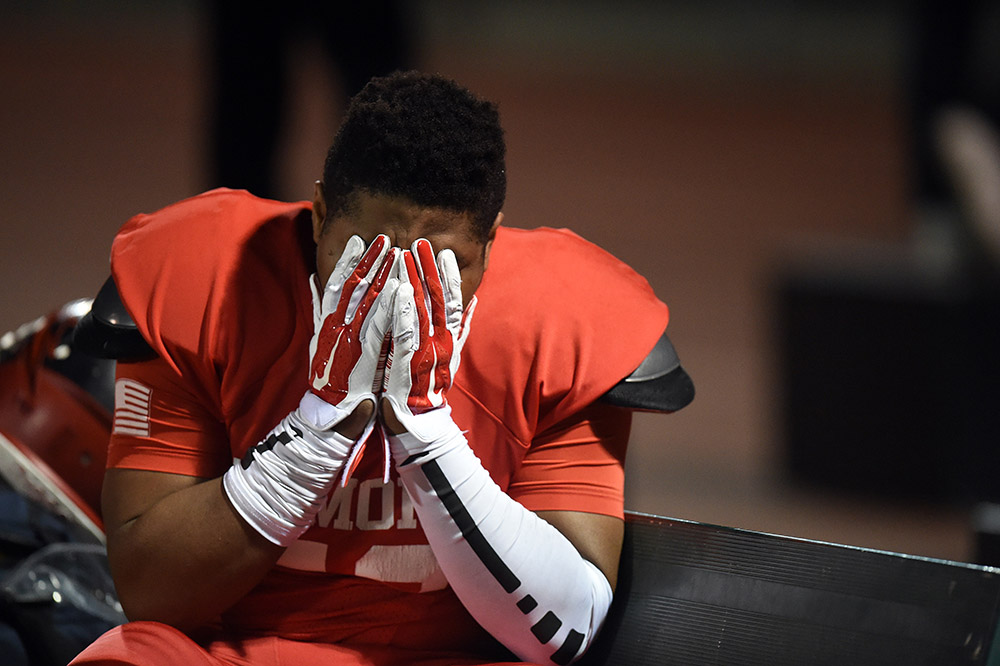 Pomona’s Hassan Abdul - qawi #53 sits on the bench during their CIF Southern Section Mid-Valley Division football semifinal against Sierra Canyon at Granada Hills High School in Granada Hills, Friday, November 27, 2015.  (Photo by Hans Gutknecht/Los Angeles Daily News)